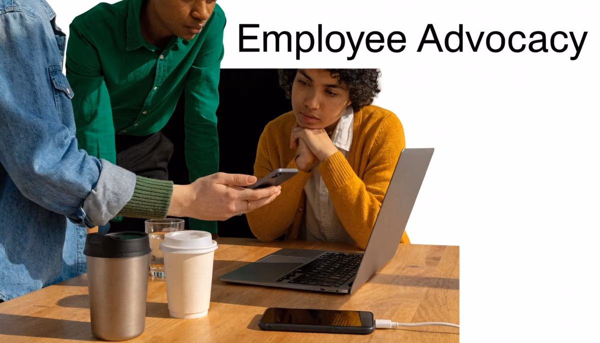 A diverse group of employees collaborating on a digital marketing strategy while working in a modern office.
